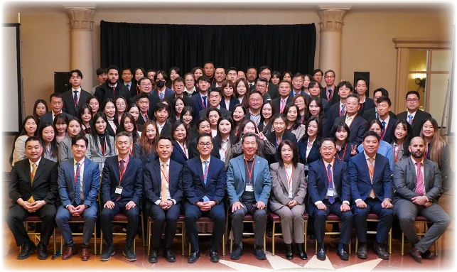 A large group photo of employees at an annual corporate meeting.